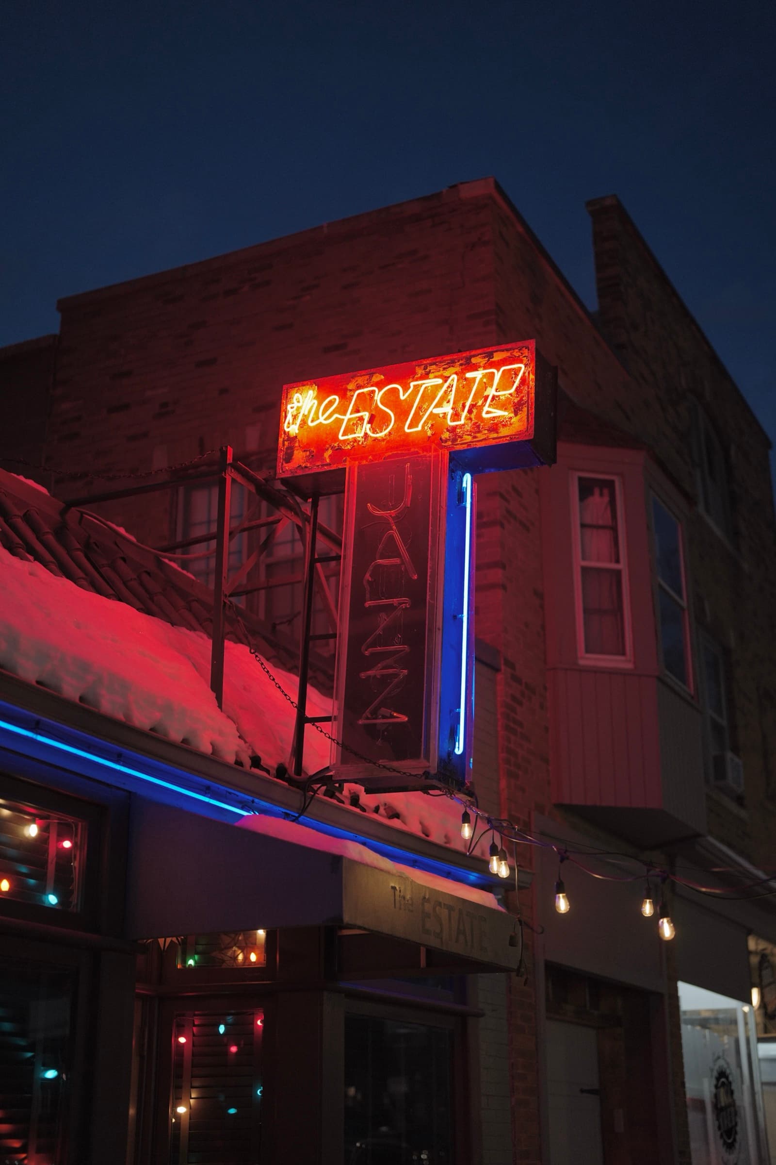 The Estate jazz club neon marquee at night, Milwaukee